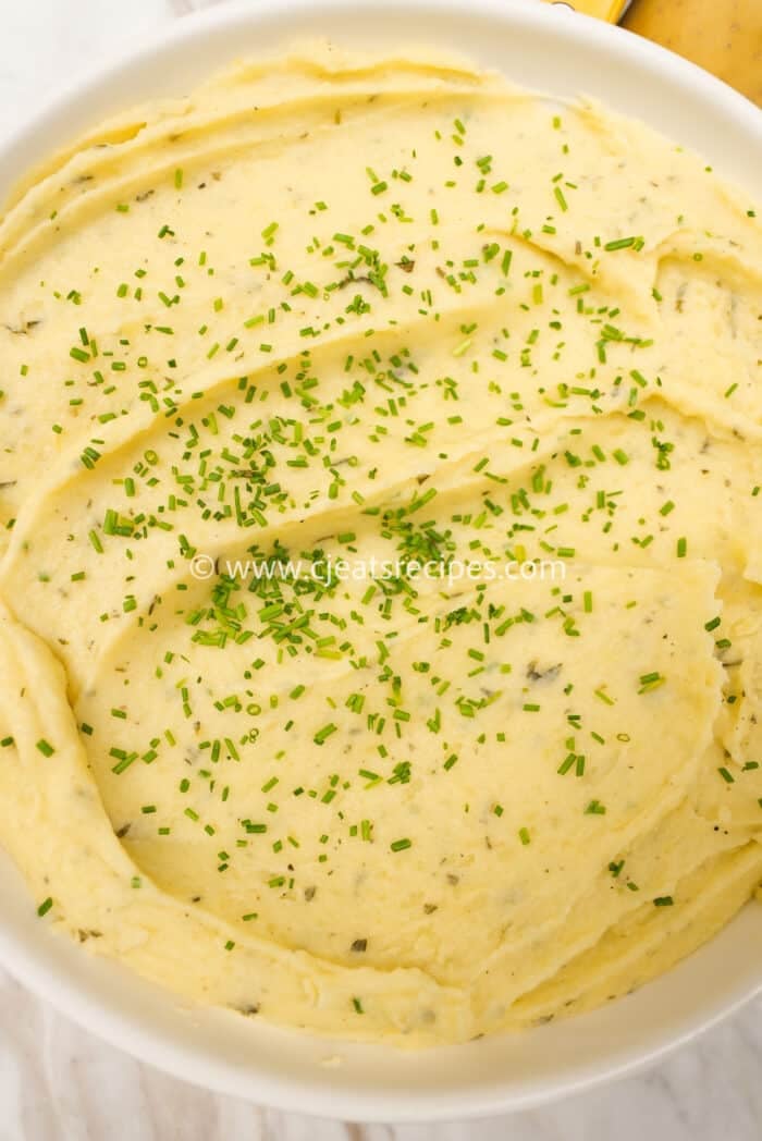 creamy mashed potatoes plated in a bowl
