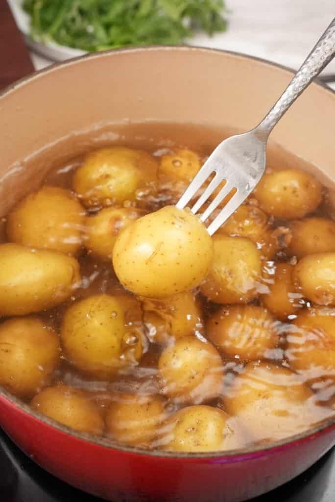 Yellow potatoes boiling in salted water.