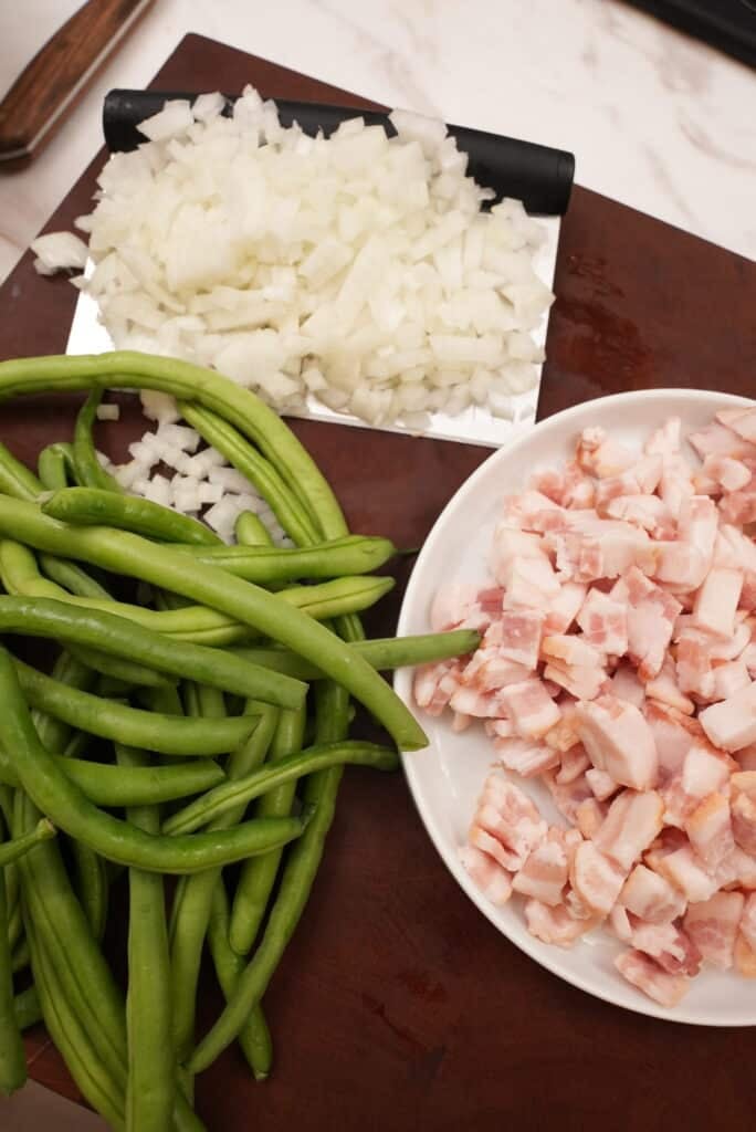 diced onion and bacon with raw green beans
