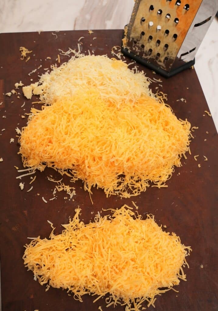 grated sharp cheddar and gruyere