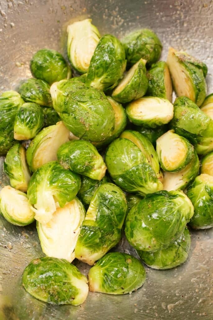 seasoned brussels sprouts in a mixing bowl