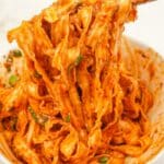 Spicy Gochujang Noodles in a bowl with chopsticks.