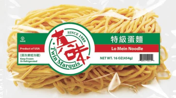A photo of raw lo mein noodles in a package.