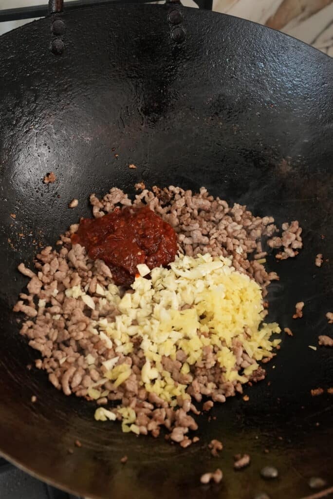Ground pork with garlic and ginger in a wok