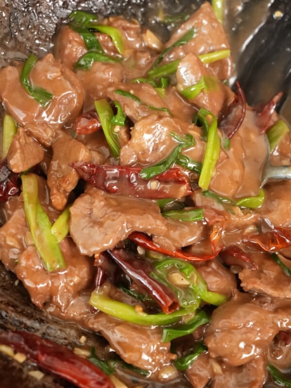 close up of mongolian beef in a wok