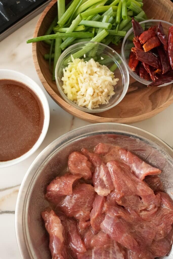 Prepped ingredients in bowls for Mongolian beef.