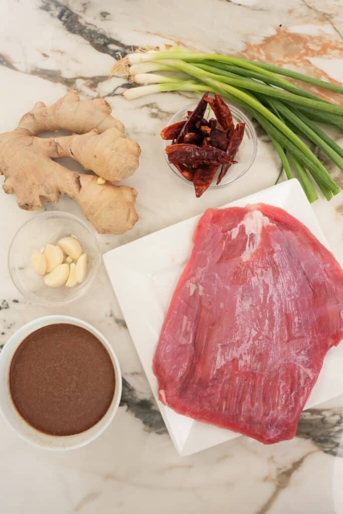 raw ingredients on a table for mongolian beef