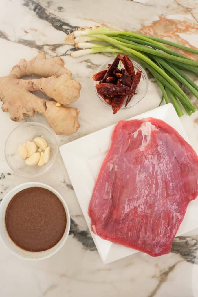 raw ingredients on a table for mongolian beef