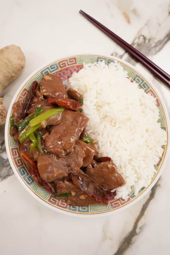 mongolian beef plated with rice