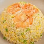 A bowl of copycat Din Tai Fung Fried Rice with Shrimp in a grey bowl.