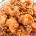 Honey Walnut Shrimp on a plate with candied walnuts.