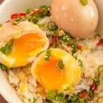 Korean Marinated Eggs (Mayak Eggs) over rice in a bowl.