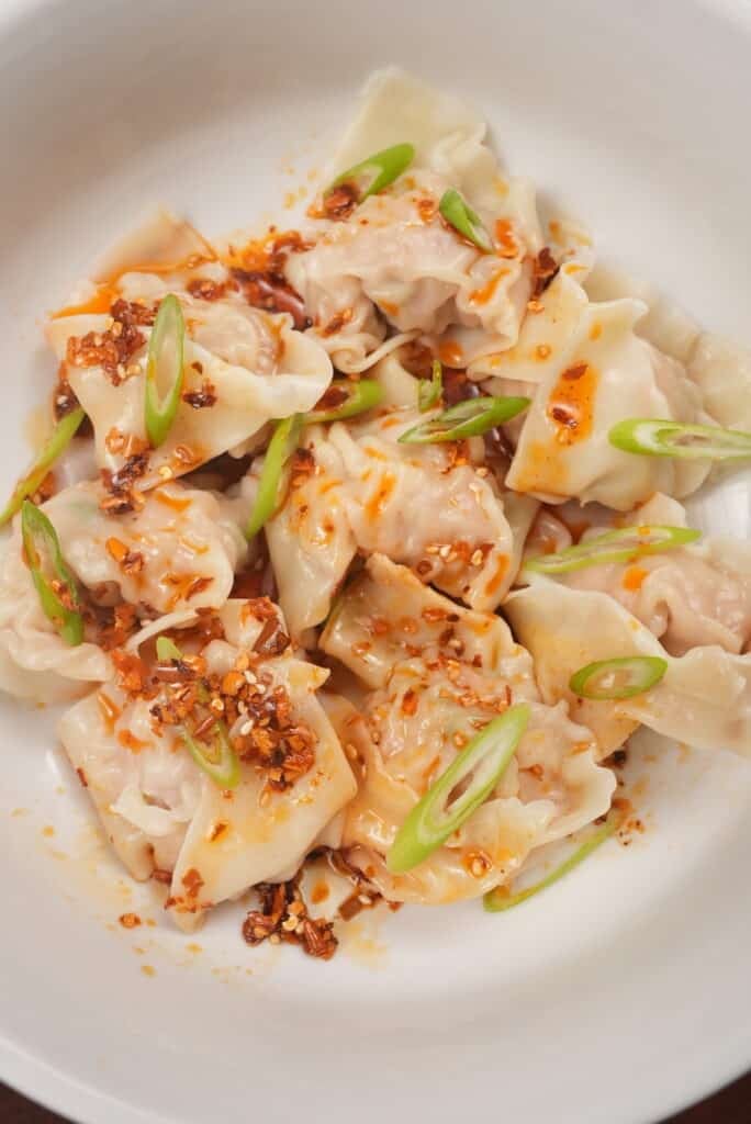 Close up of pork and shrimp wontons in a bowl