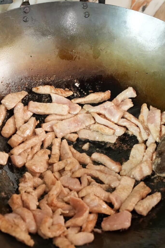 pork cooking in a wok