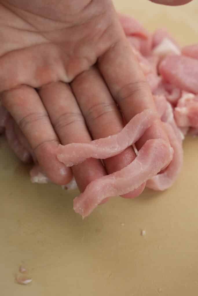 Sliced pork on a cutting board