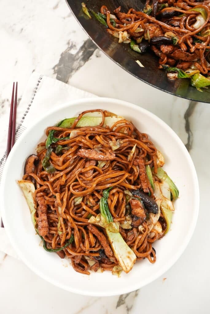 Shanghai Fried Noodles on a plate with wok