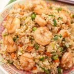 Shrimp Fried Rice on a plate with chopsticks.