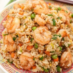 Shrimp Fried Rice on a plate with chopsticks.