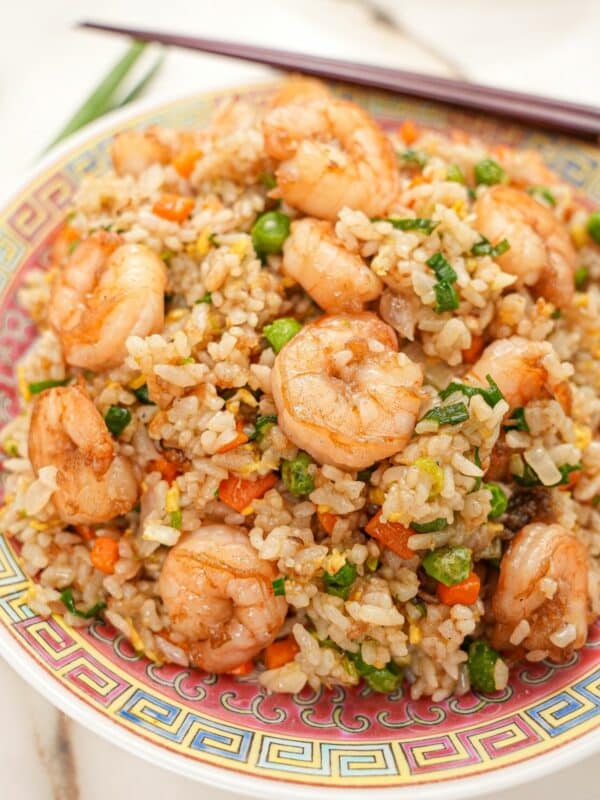 Shrimp Fried Rice on a plate with chopsticks.