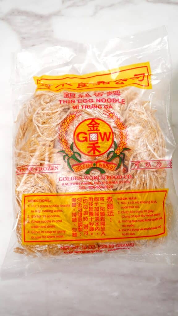 Raw wonton noodles in a plastic package.