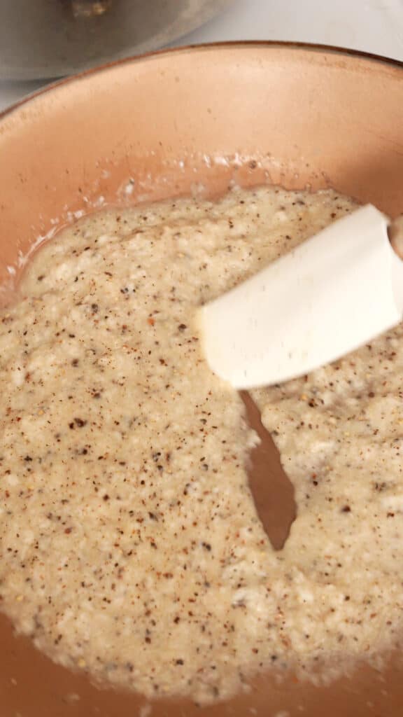 mixing sauce for cacio e pepe