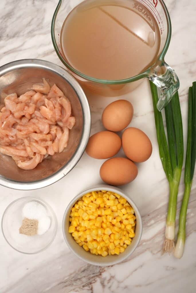 Raw ingredients for chicken corn egg drop soup
