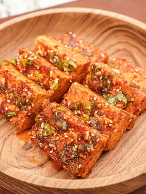 Korean braised tofu (Dubu Jorim) on a wooden bowl.