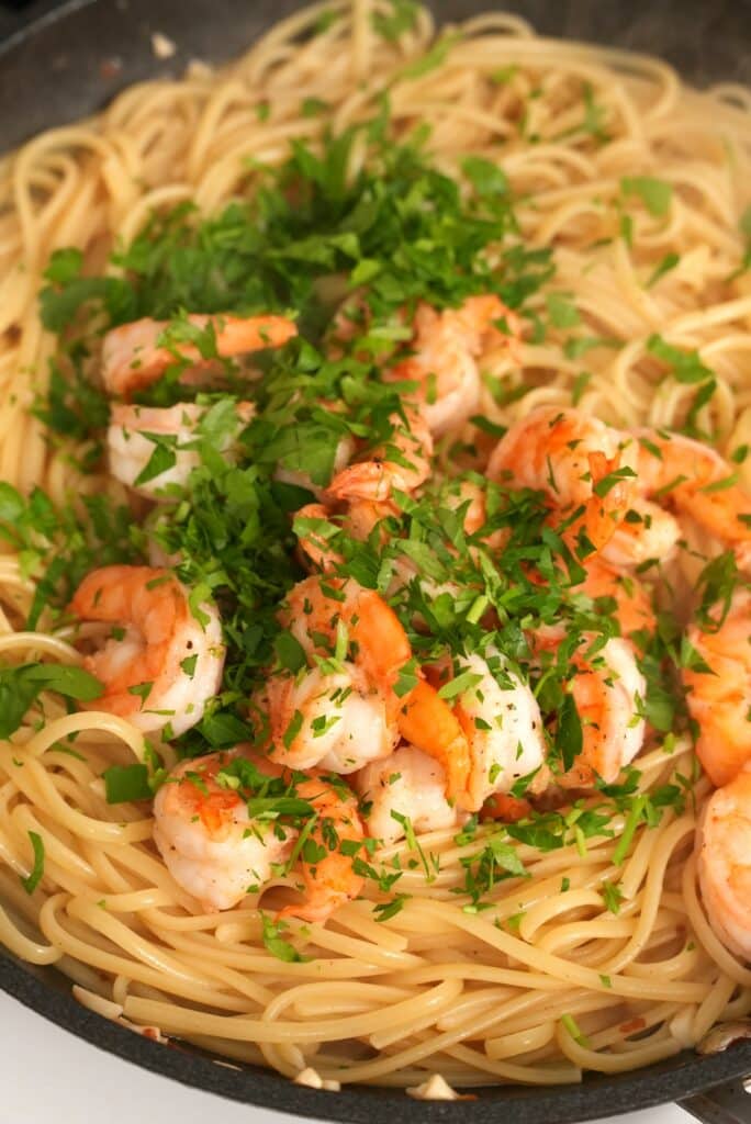 Pasta with shrimp and parsley before mixing