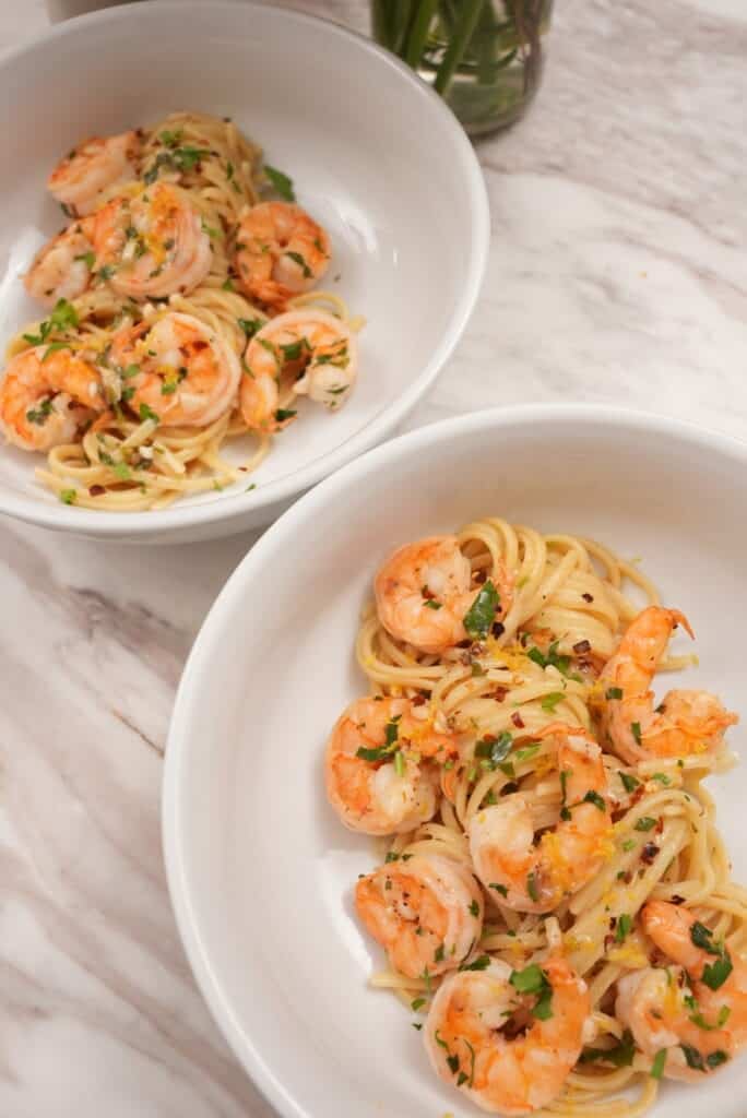 shrimp scampi pasta plated in bowls