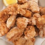Chicken Karaage (Japanese Fried Chicken) in a bowl with a lemon wedge.