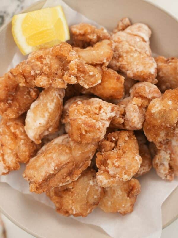 Chicken Karaage (Japanese Fried Chicken) in a bowl with a lemon wedge.