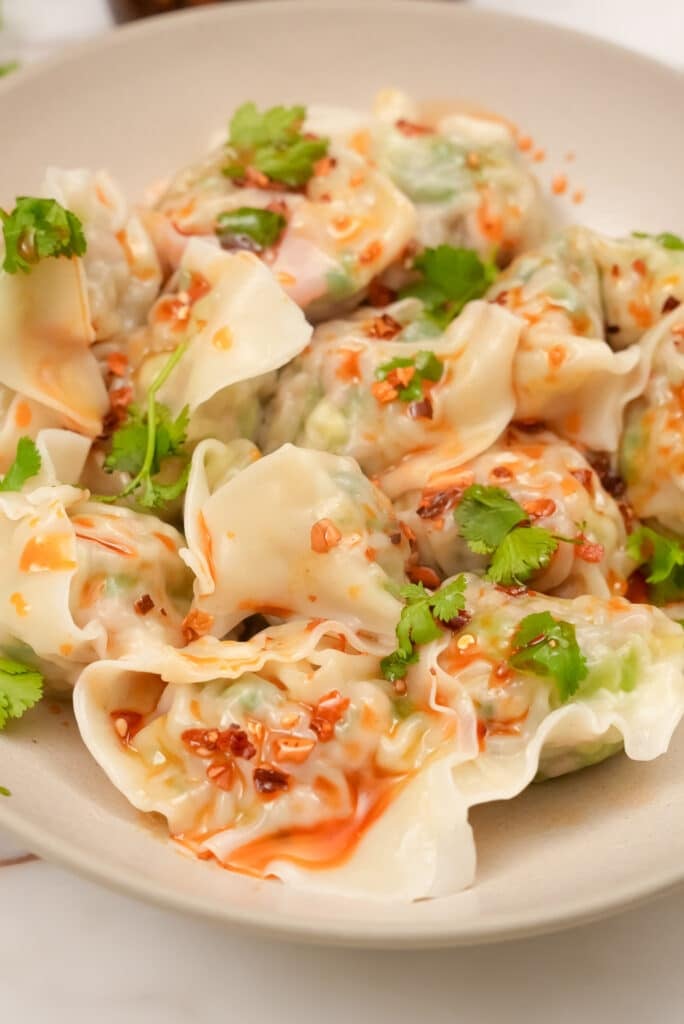 Close up of chicken and cilantro wontons
