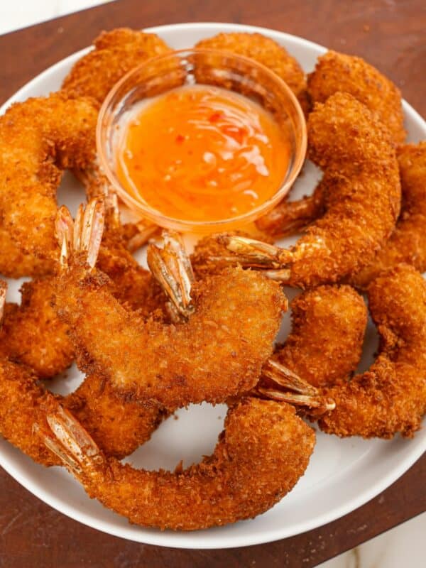 Coconut Shrimp on a plate with sweet chili sauce.