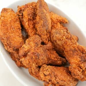 Crispy Five Spice Chicken Wings on a white tray.