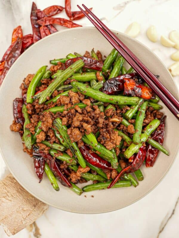 Chinese Green Beans with Pork in a bowl with chopsticks.