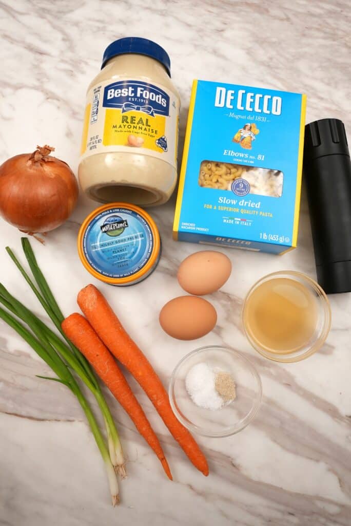 Raw ingredients for Hawaiian Macaroni Salad on a table