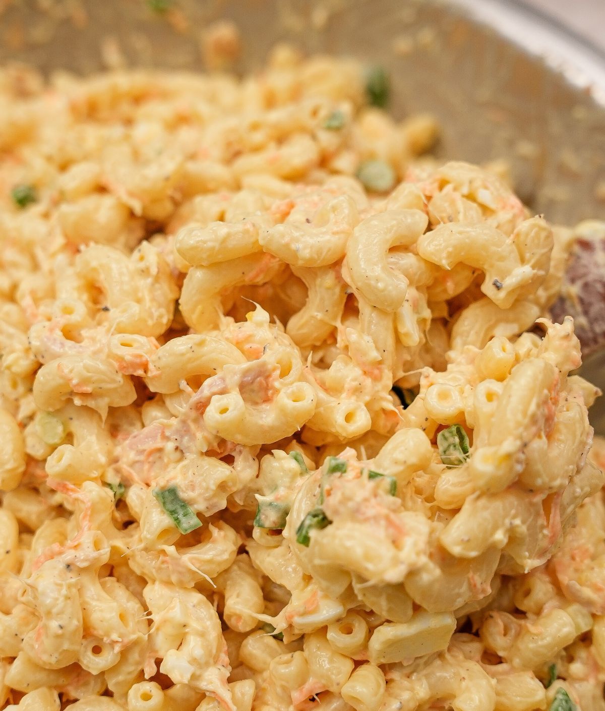 Hawaiian Macaroni Salad in a bowl with a spoon.