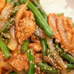 String Bean Chicken Breast in a bowl on top of white rice.