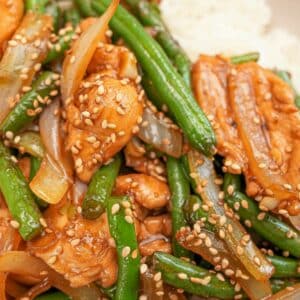 String Bean Chicken Breast in a bowl on top of white rice.