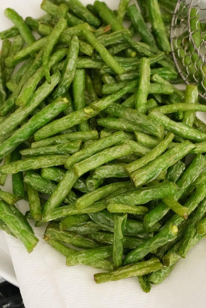 Green Beans fried and draining on a towel