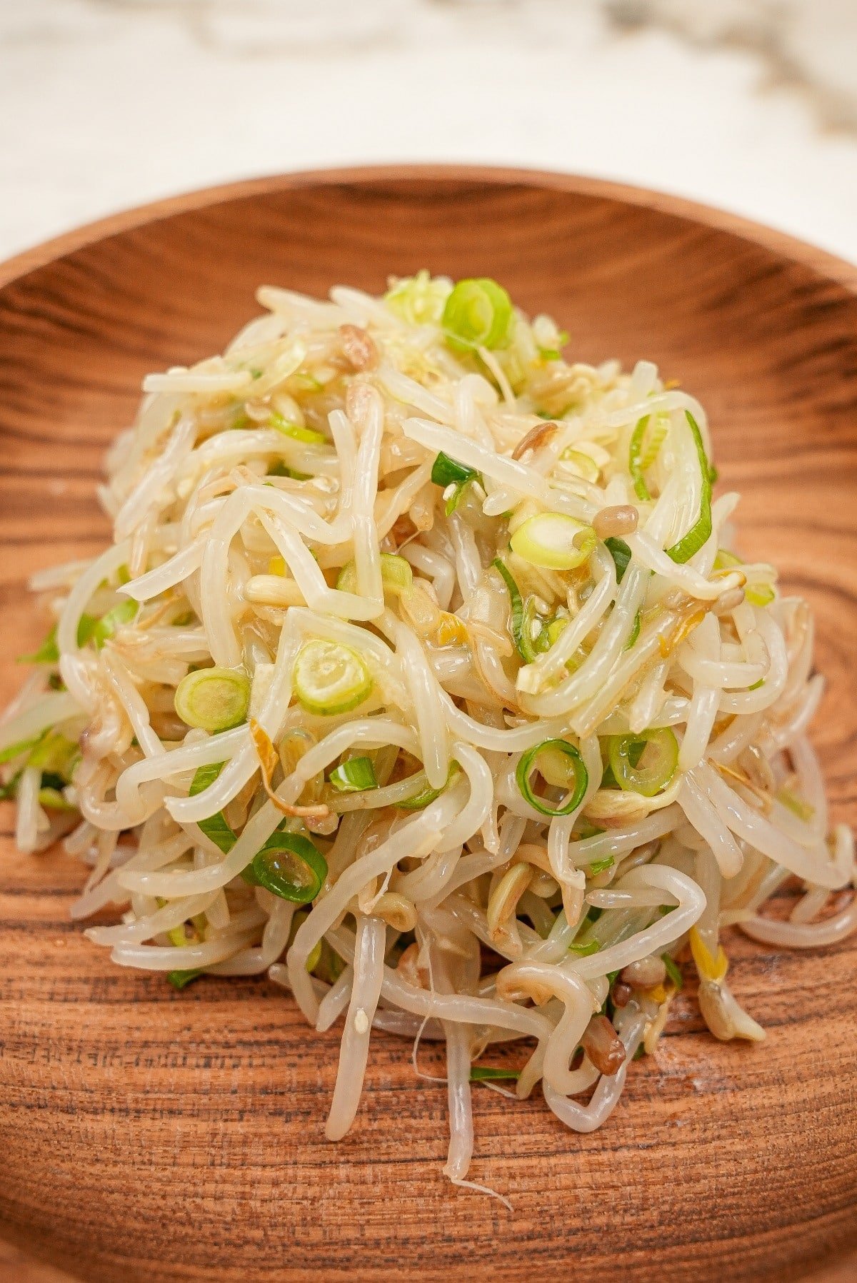 Korean Bean Sprout Side Dish in a wooden bowl.