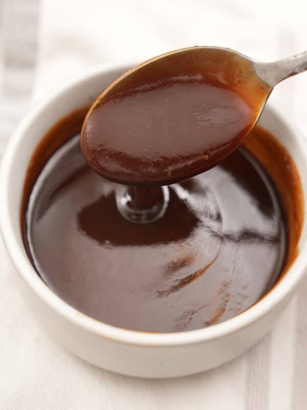 Authentic Homemade Tonkatsu sauce in a bowl with a spoon.