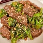 An authentic Beef and Broccoli in a bowl with white rice.