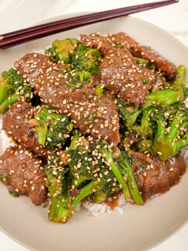 An authentic Beef and Broccoli in a bowl with white rice.