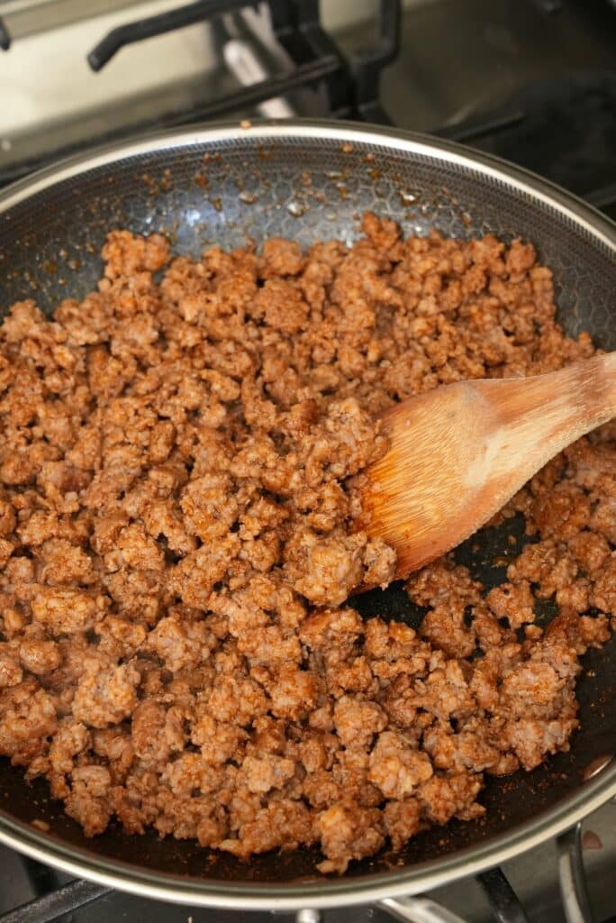 Sausage browning in a skillet.