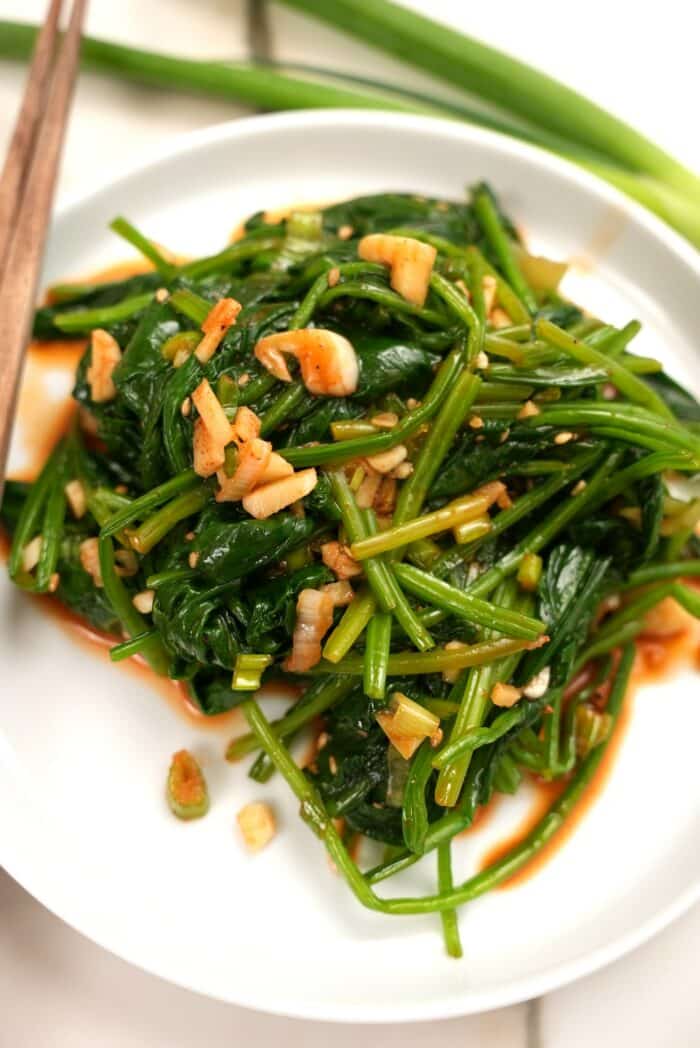 Spicy korean spinach side dish close up on a plate