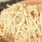 An authentic, creamy Cacio e Pepe with pasta, pecorino romano cheese, black peppercorns, and pasta water.