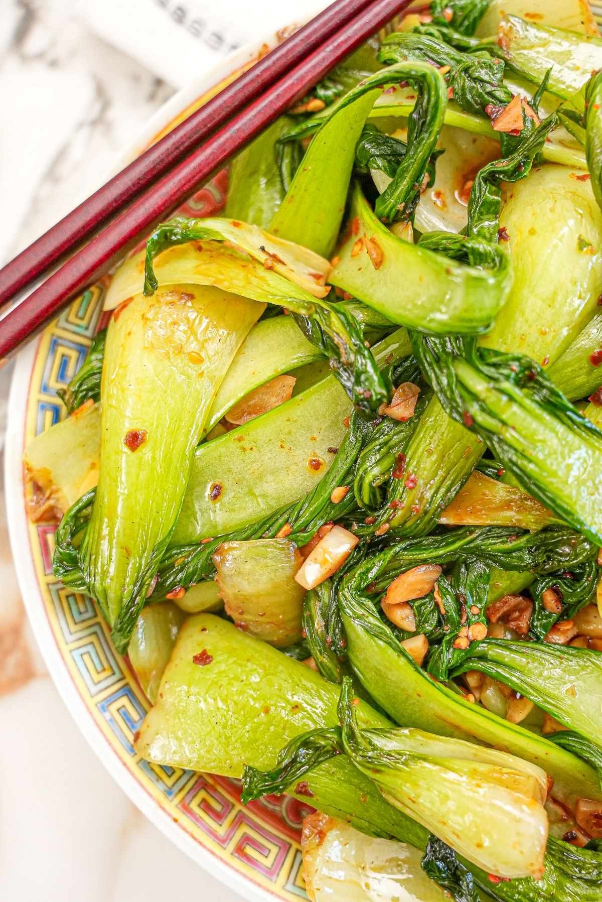 Chili Garlic Bok Choy in a plate with chopsticks.