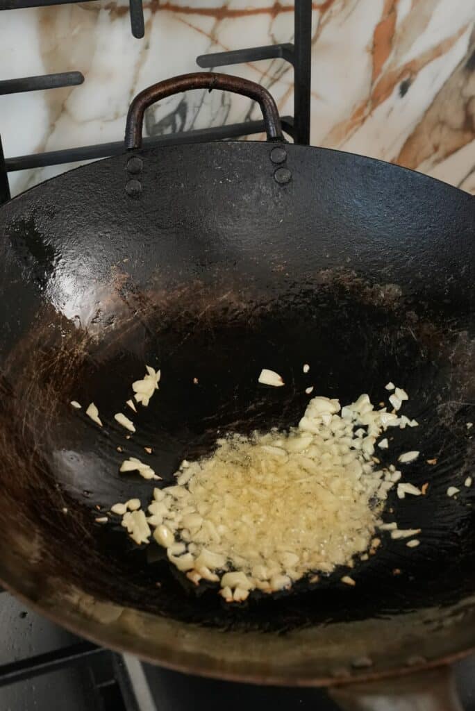 Cooking garlic in a wok