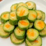 Copycat Din Tai Fung Cucumber Salad stacked on a white plate.